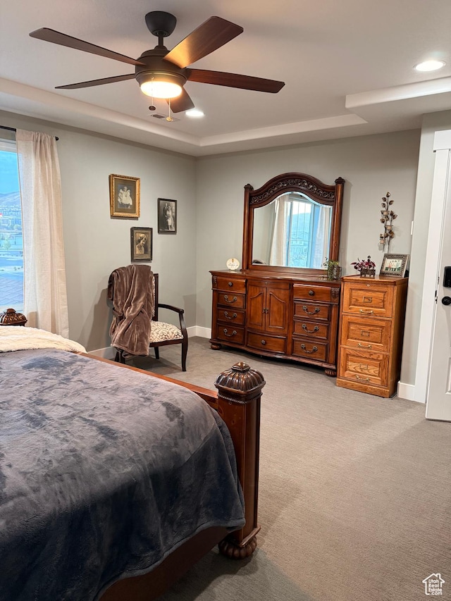 bedroom featuring light colored carpet, multiple windows, ceiling fan, and recessed lighting