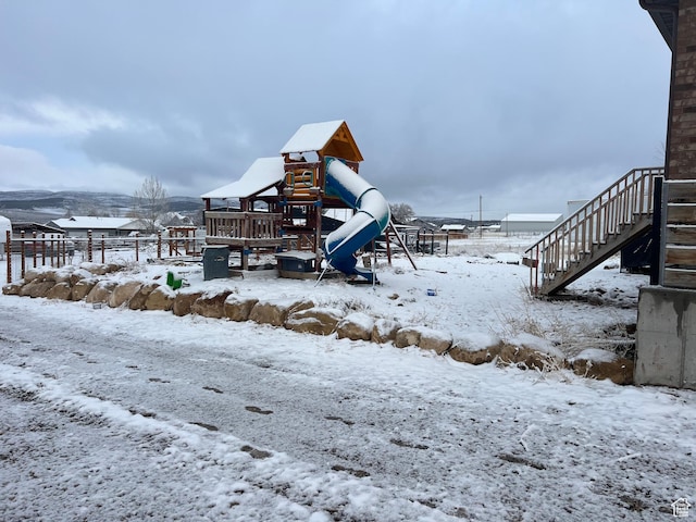 247 N 300 E, Fairview, UT 84629 - yard covered in snow with fence, stairs, and a playground