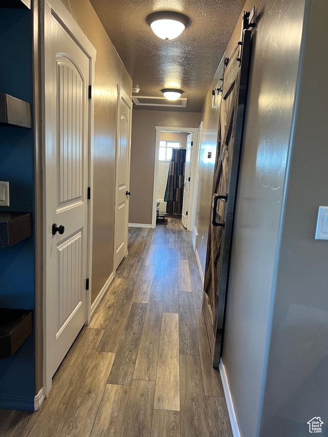 247 N 300 E, Fairview, UT 84629 - corridor with baseboards, wood finished floors, and a textured ceiling