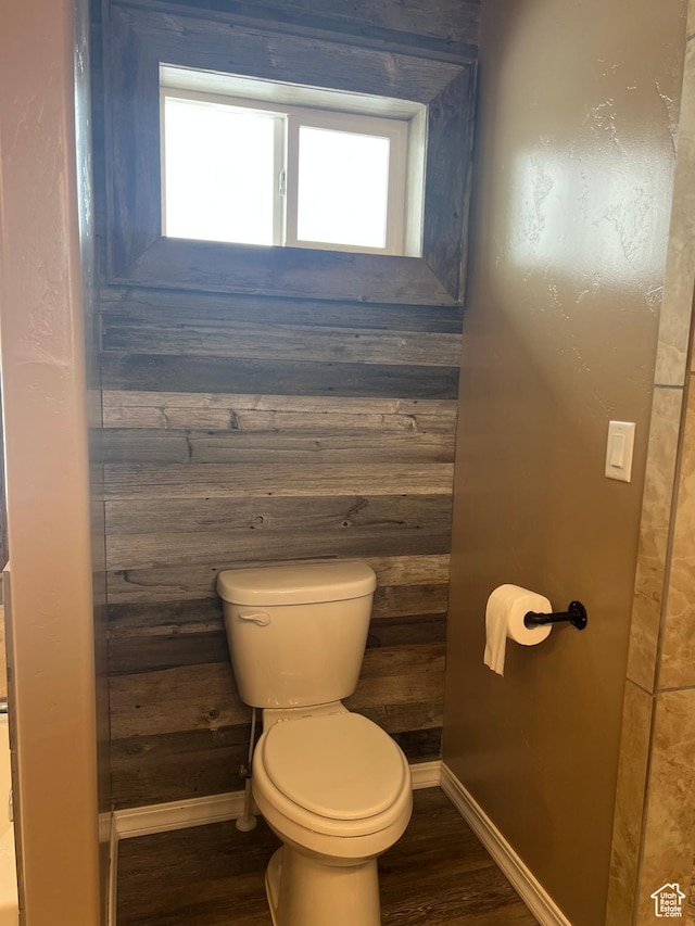 247 N 300 E, Fairview, UT 84629 - bathroom with wood walls, wood finished floors, baseboards, and toilet
