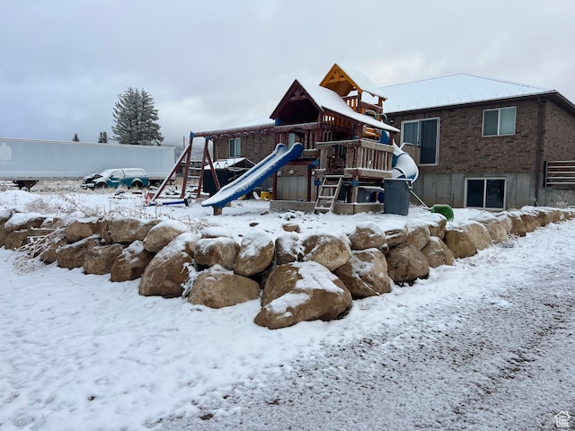 247 N 300 E, Fairview, UT 84629 - snow covered property with brick siding and a playground