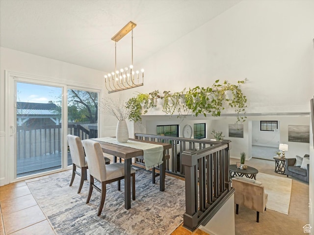dining room featuring a chandelier and tile patterned floors