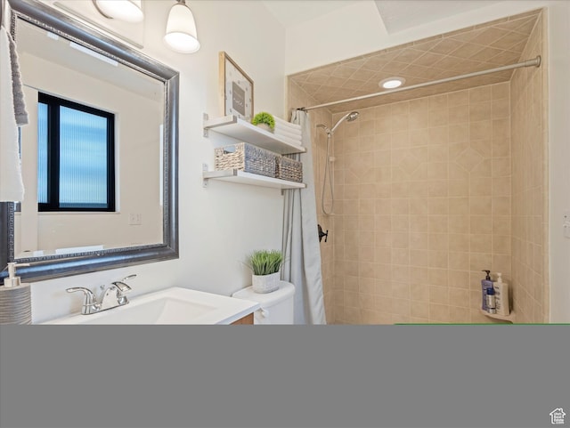 full bathroom with toilet, walk in shower, and vanity