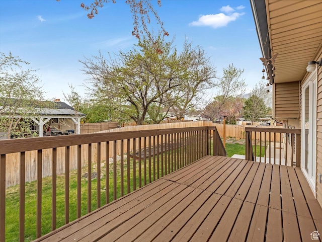 deck featuring a fenced backyard and a yard