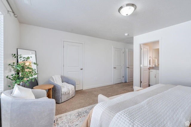 carpeted bedroom with baseboards