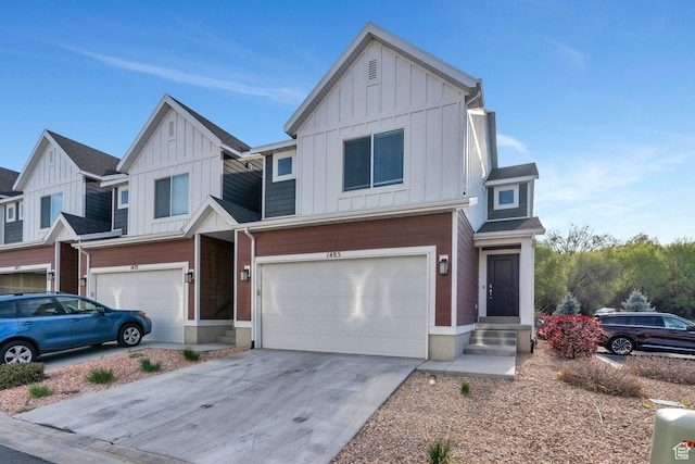 view of front facade with concrete driveway, board and batten siding, and a garage