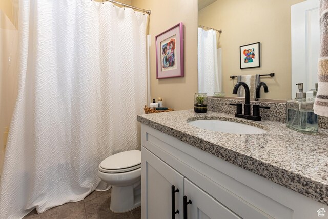 full bath featuring a shower with curtain, tile patterned floors, vanity, and toilet