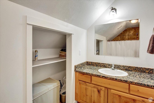 10716 N Hayes Cir, Cedar Hills, UT 84062 - full bath featuring vaulted ceiling, a shower with shower curtain, and vanity