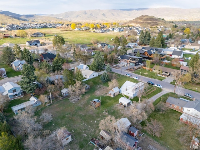 birds eye view of property with a mountain view and a residential view