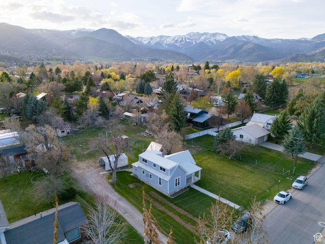 birds eye view of property with a mountain view and a residential view