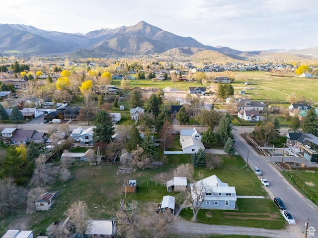 birds eye view of property with a mountain view and a residential view