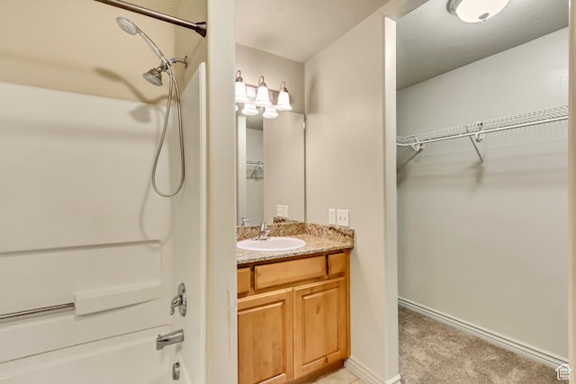 289 S 1000 W Unit 201, Pleasant Grove, UT 84062 - bathroom with a walk in closet, baseboards, shower / bath combination, and vanity