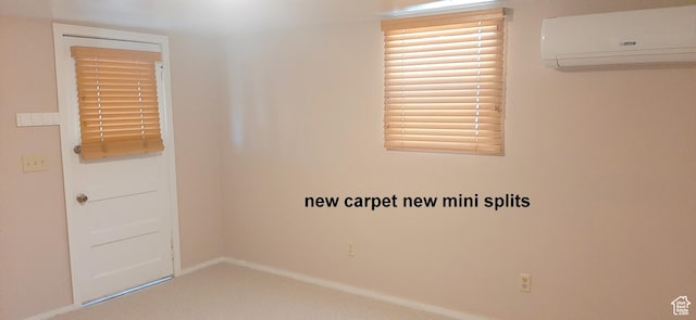 338 E 100 N, Moab, UT 84532 - carpeted empty room featuring a wall mounted air conditioner and baseboards