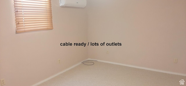 338 E 100 N, Moab, UT 84532 - carpeted empty room featuring baseboards and a wall mounted air conditioner