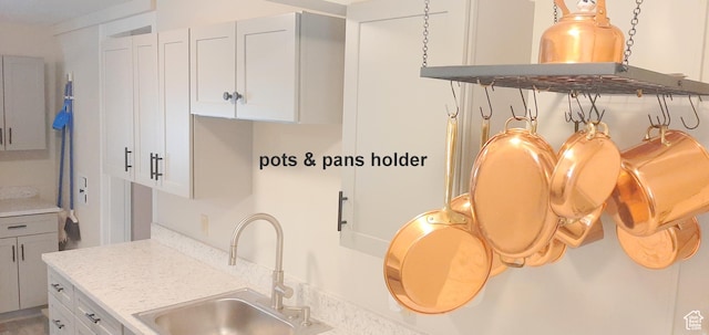 338 E 100 N, Moab, UT 84532 - kitchen featuring white cabinetry and a sink