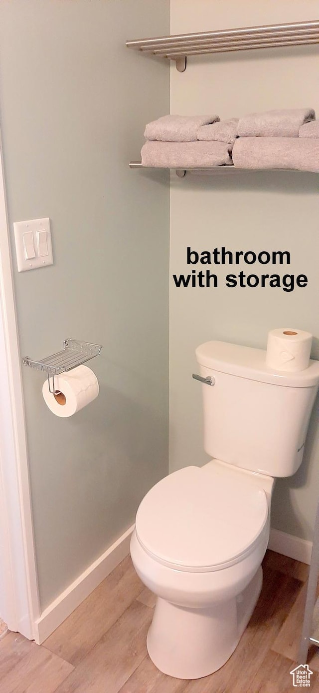 338 E 100 N, Moab, UT 84532 - bathroom featuring wood finished floors, toilet, and baseboards