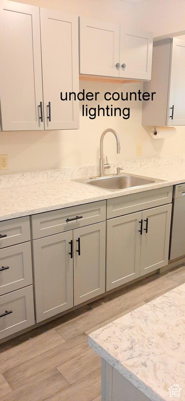 338 E 100 N, Moab, UT 84532 - kitchen with dishwasher, light wood finished floors, gray cabinetry, and a sink