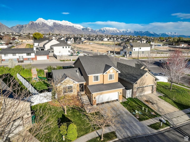 birds eye view of property with a residential view and a mountain view
