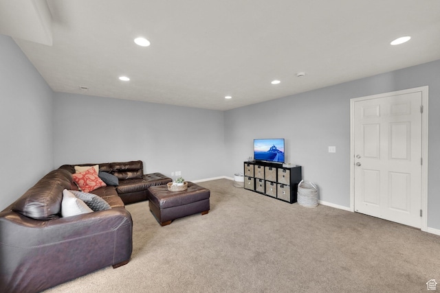 carpeted living room featuring baseboards and recessed lighting