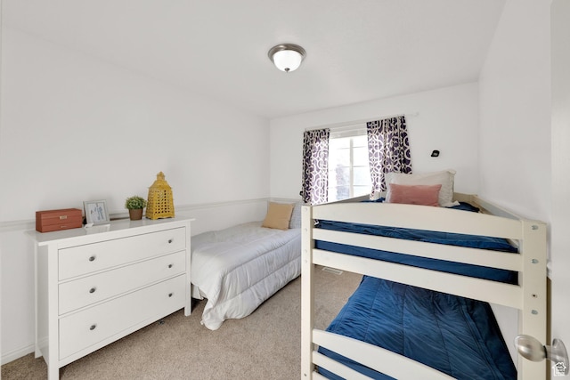 bedroom with light carpet