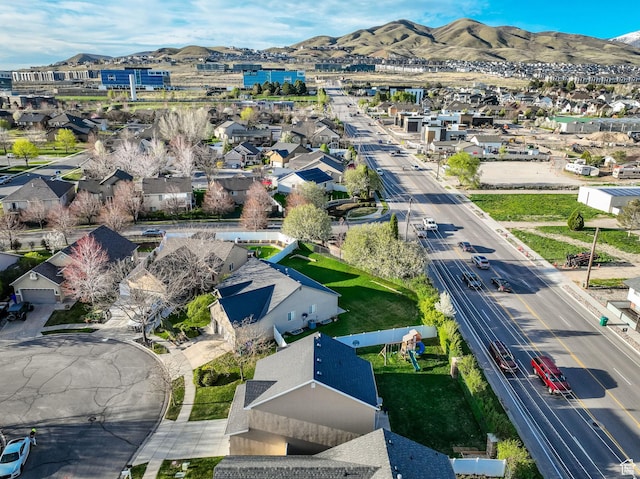 birds eye view of property with a residential view and a mountain view