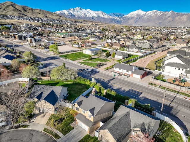 drone / aerial view featuring a mountain view and a residential view