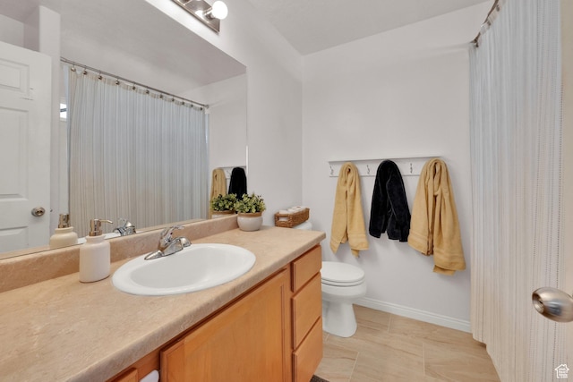 bathroom featuring tile patterned floors, vanity, curtained shower, baseboards, and toilet