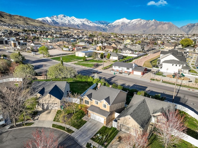 birds eye view of property with a mountain view and a residential view