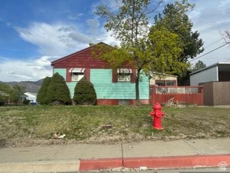 387 W 4575 S, Washington Terrace, UT 84405 - view of side of home featuring fence