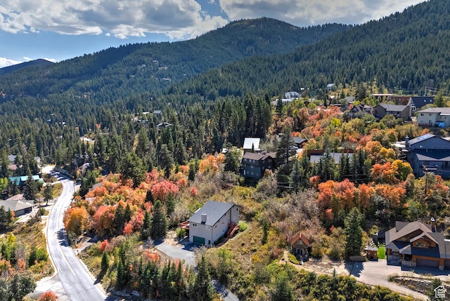 bird's eye view with a residential view, a view of trees, and a mountain view