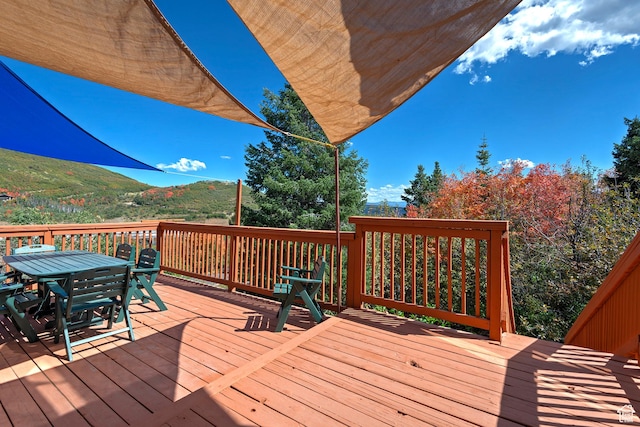 deck featuring outdoor dining area