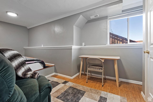 living area with baseboards, wood finished floors, and visible vents