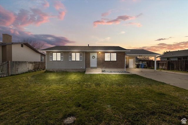 781 N 950 W, Orem, UT 84057 - bungalow-style house featuring an attached carport, fence, driveway, and a front yard