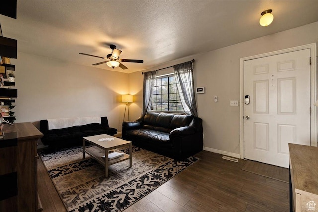 781 N 950 W, Orem, UT 84057 - living area with dark wood-style floors, a textured ceiling, ceiling fan, baseboards, and visible vents