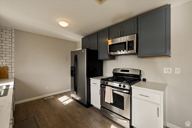 781 N 950 W, Orem, UT 84057 - kitchen featuring white cabinets, stainless steel appliances, dark wood-style flooring, visible vents, and baseboards