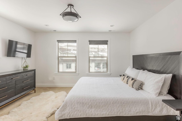 1052 W Cattail Ct Unit E1, Kamas, UT 84036 - bedroom with visible vents, light carpet, and baseboards