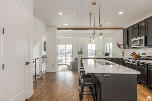 1052 W Cattail Ct Unit E1, Kamas, UT 84036 - kitchen with recessed lighting, a kitchen breakfast bar, stainless steel appliances, and a sink
