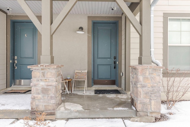 1052 W Cattail Ct Unit E1, Kamas, UT 84036 - snow covered property entrance featuring stucco siding