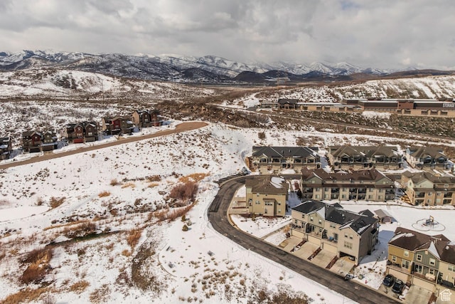 1052 W Cattail Ct Unit E1, Kamas, UT 84036 - snowy aerial view with a mountain view and a residential view