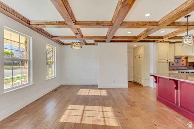 unfurnished dining area with light wood-style floors, baseboards, coffered ceiling, beam ceiling, and recessed lighting