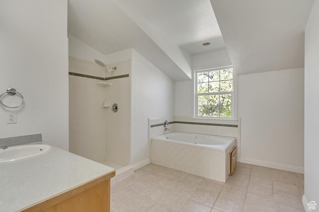 full bath with a bath, vaulted ceiling, tile patterned flooring, and a shower