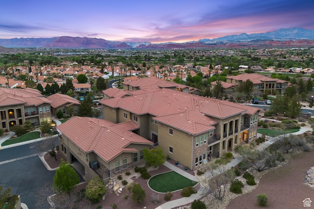 aerial view at dusk with a residential view and a mountain view