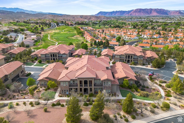birds eye view of property featuring a mountain view and a residential view