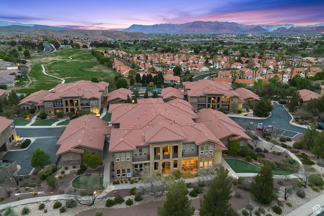 aerial view at dusk with a residential view and a mountain view