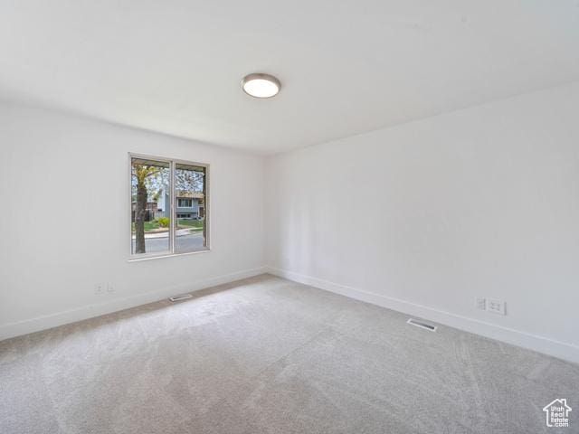 704 W Daisy Ln S, Murray, UT 84123 - carpeted empty room with baseboards and visible vents