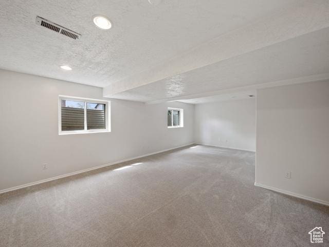 704 W Daisy Ln S, Murray, UT 84123 - below grade area featuring baseboards, visible vents, a textured ceiling, and carpet flooring