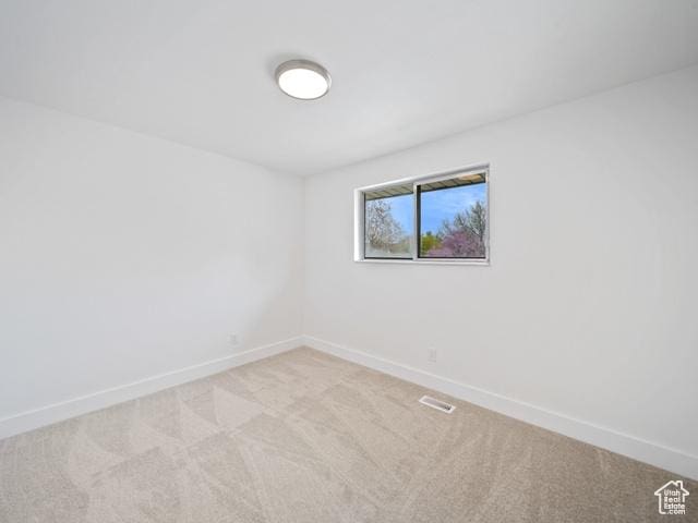 704 W Daisy Ln S, Murray, UT 84123 - spare room featuring carpet flooring and baseboards