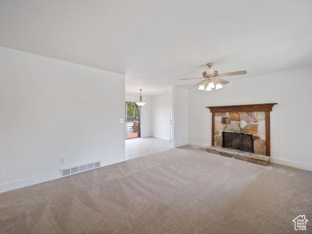 704 W Daisy Ln S, Murray, UT 84123 - unfurnished living room with a ceiling fan, visible vents, carpet, and a fireplace