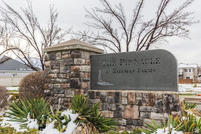 community sign featuring fence