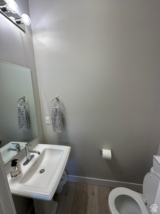 413 S 980 W, American Fork, UT 84003 - bathroom with baseboards, toilet, wood finished floors, and a sink